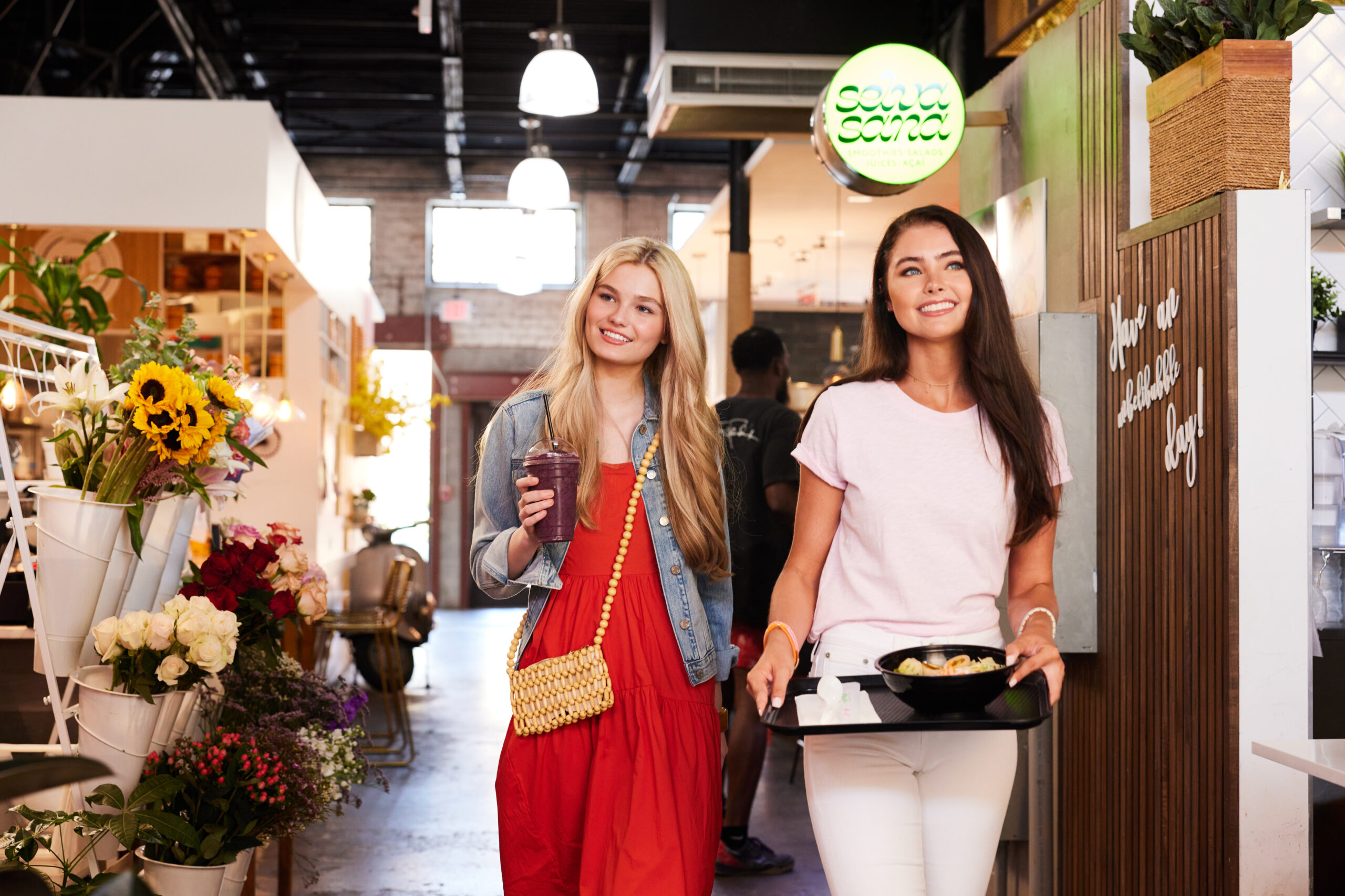 girls walking in food hall