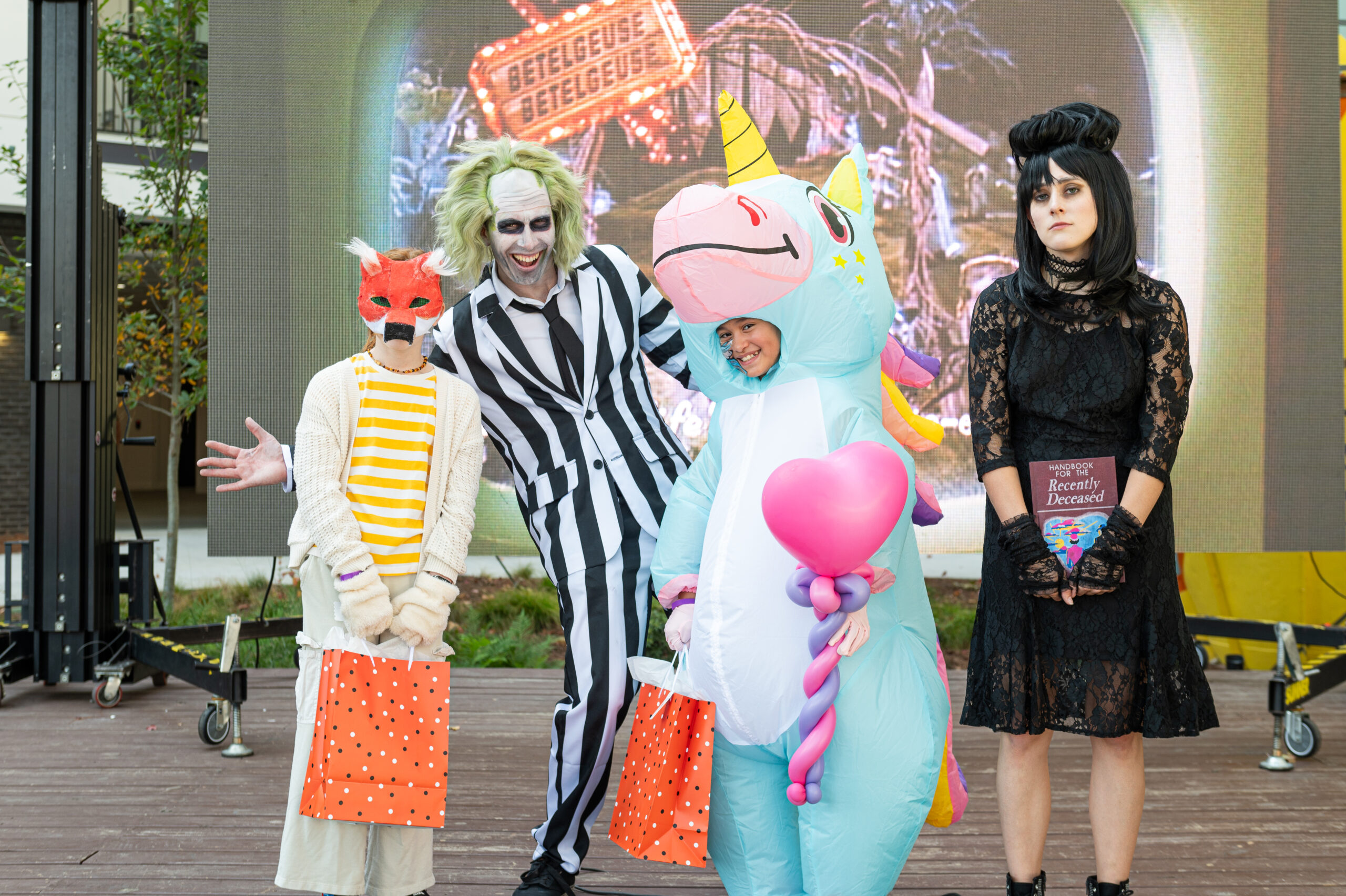 group on stage dressed up for halloween